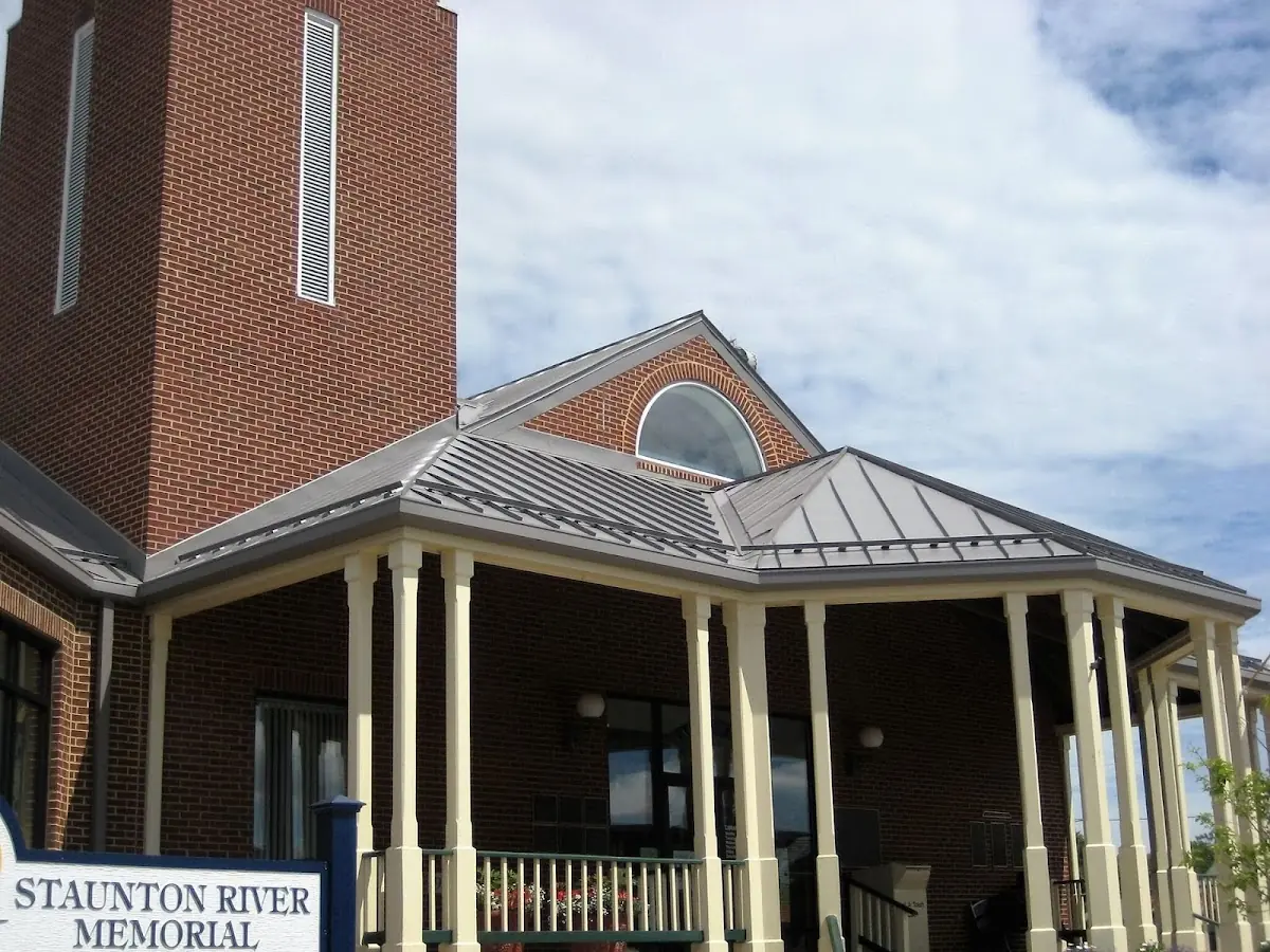 Skilled roofing craftsmen working on a residential roof in Parkview